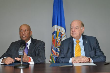 Secretary General of the Organisation of American States (OAS), José Miguel Insulza (right), and the Permanent Representative of Guyana to the Organisation, Bayney Karran (OAS photo)