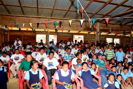 Residents of Kurukabaru, Region Eight attending a community meeting hosted by President Donald Ramotar and Amerindian Affairs Minister Pauline Sukhai. (GINA photo)
