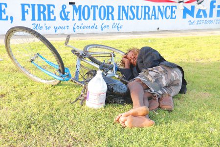 This man was resting up along the Kitty seawall on his bicycle with his shoes secured under him. (Arian Browne photo)