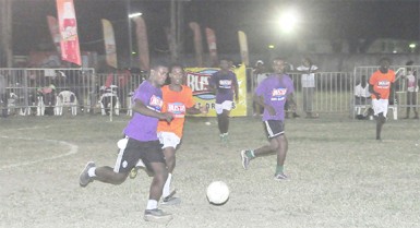 Flashback-Randolph Wagner of West Front Road racing down the centre of the field following a counterattack while being pursued by Queen Street Tigerbay’s Deon Alfred during their earlier group fixture