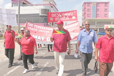 PPP General Secretary Clement Rohee (centre) marches with other PPP/C candidates, including head of the sugar workers’ union Komal Chand (at far right) at the front of the Federation of Independent Trade Unions of Guyana (FITUG) procession yesterday. (Photo by Arian Browne)
