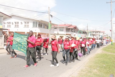Members of the Guyana Teachers’ Union marching along d’Urban Street yesterday. (Arian Browne photo) 