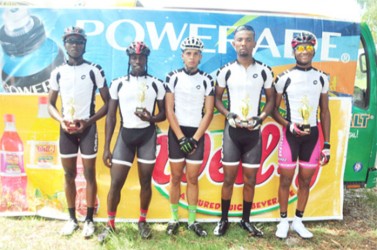 Winner’s row! Team Evolution cyclists (from right to left) Michael Anthony, Marlon Williams, Raul Leal, Orville Hinds and Akeem Wilkinson. (Orlando Charles photo) 