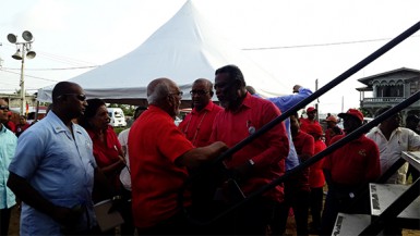 As President Donald Ramotar (centre) arrived at the rally, as it was already underway, he was greeted by former President Bharrat Jagdeo and Prime Minister Samuel Hinds. 