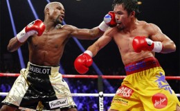Floyd Mayweather lands a left to the head of Manny Pacquiao during Saturday night’s mega welterweight world title fight.
