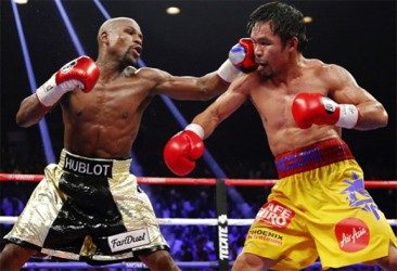 Floyd Mayweather lands a left to the head of Manny Pacquiao during Saturday night’s mega welterweight world title fight.
