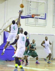 Action between Guyana (green) and Suriname (white) in the third match of their international basketball series contested at Ismay Van Wilgen Sports Hall in Paramaribo.