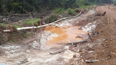 Sections of the Water Dog Road heading to North Fork from Mahdia have eroded exposing the Salbora water pipe. The roadway is being moved and rehabilitated by Mekdeci Machinery and Construction. 