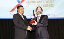NPI General Manager Mahendra Persaud receiving the  award in Kingston, Jamaica.
