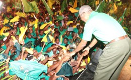 Supporters rush to shake APNU+AFC presidential candidate David Granger’s hands at the coalition’s final rally last night at the Square of the Revolution. (Arian Browne photo)

