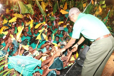 Supporters rush to shake APNU+AFC presidential candidate David Granger’s hands at the coalition’s final rally last night at the Square of the Revolution. (Arian Browne photo) 