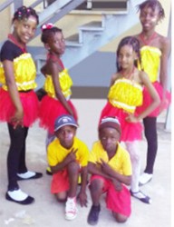  This composite photo shows the children on the morning before they left for Calcutta, Mahaicony. Standing from left are Asiyah Abel and Azaliah Fraser, six, while standing from right are Atesha Woolford and Martina Persaud. Kneeling in front row are Joel Justin Abel (right) and Rayden Abel. 
