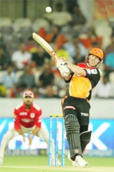 David Warner captain of the Sunrisers Hyderabad hits a delivery for six during yesterday’s match of the 2015 Indian Premier League between Sunrisers Hyderabad and Kings XI Punjab at the Rajiv Gandhi International Cricket Stadium in Hyderabad, India. (Photo IPL website)