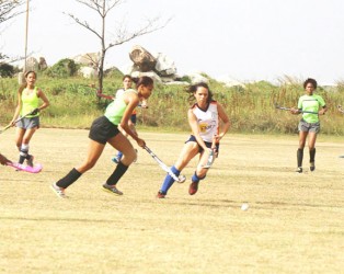 In Photo GCC’s Tricia Woodroffe, second right, tracks the run of Hikers winger Shundel Durant in Sunday’s clash.