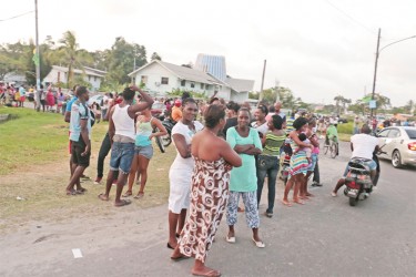 Residents waiting outside the Church of the Transfiguration last evening after the close of polls. 