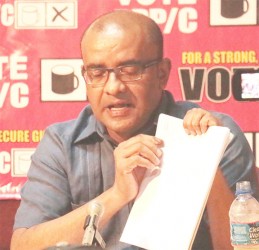 Former President Bharrat Jagdeo holding up the results of the PPP/C verification last evening of seven allegedly irregular Statement of Polls results showcasing the tabulations by the party and the discrepancies in Gecom’s tabulations.  
