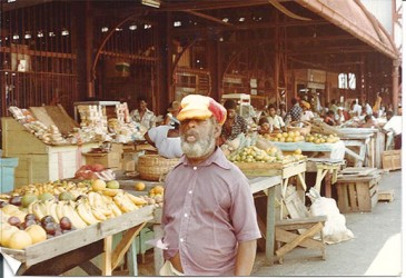 The vendors’ gauntlet extends south beneath the Stabroek Market awning and beyond 