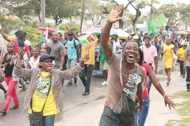 Jubilant APNU+AFC  supporters along South Road after the announcement of the preliminary results yesterday.