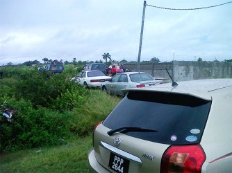 Persons parked their vehicles and left in search for vacant lands in the Mon Repos cane field which is said to be owned by GuySuCo. 