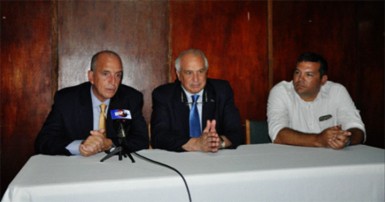 PAHF President Alberto Budeisky (left) addressing the media gathering at the Georgetown Cricket Club while FIH President Leandro Negre (centre) and GHB President Phillip Fernandes look on. 