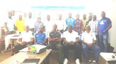  The participating members (standing) alongside course instructors (sitting) of the GFF Referee Instructor/Assessor Clinic posing for a photo opportunity following its conclusion.