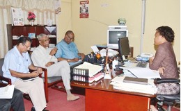 President David Granger (centre at left),  Minister of State, Joseph Harmon (third from left), and Permanent Secretary of the Public Service Ministry, Hydar Ally (left) during a meeting at the Public Service Ministry’s Training Division with Soyinka Grogan, Manager of the Scholarship Division. (GINA photo)
