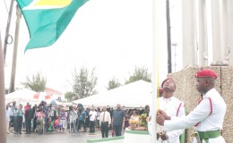 The Golden Arrowhead being raised yesterday morning at Independence Arch, Brickdam in observance of Guyana’s 49th anniversary of independence. (Arian Browne photo)