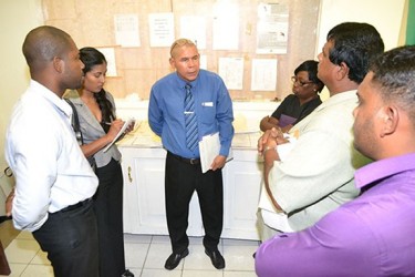 Minister of Public Health, Dr. George Norton (centre) interacting with some of the staff at the West Demerara Regional Hospital (WDRH), Region Three (GINA photo)
