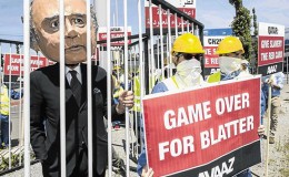 An activist wears a giant mask depicting FIFA President Sepp Blatter during a protest yesterday by the Avaaz.org organisation in Zurich, Switzerland, prior to today’s Fifa congress. Avaaz.org wants Blatter to be held accountable for the corruption at Fifa ENNIO LEANZA/EPA