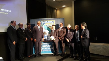 CONCACAF President Jeffrey Webb (4th from left) and Costa Rica Football Federation President Eduardo Li (1st from right) posing with members of the 65th FIFA Congress delegation before being charged with corruption by Swiss police and the United States of America on Wednesday.