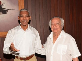 President David Granger (left) and Sir Shridath Ramphal sharing a light moment yesterday (GINA photo)