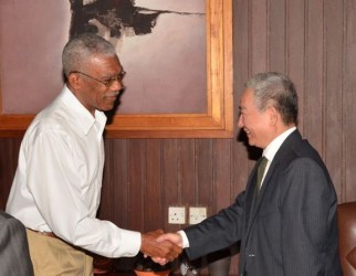 President David Granger (left) meeting Chinese Ambassador Zhang Limin at the Ministry of the Presidency (GINA photo)   