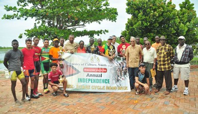 The prize winners of this year’s 33rd Independence Three-Stage Cycle Road Race posing with Minister of Education, Dr Rupert Roopnaraine and organizers of the event. (Orlando Charles photo)