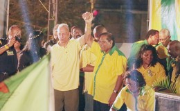 APNU+AFC  prime ministerial candidate Moses Nagamootoo (right) clenching hands with Dr Cheddi Jagan Jr at the rally last night at the Square of the Revolution.
