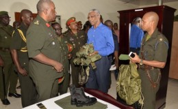 Chief of Staff of the Guyana Defence Force,  Brigadier Mark Phillips (left) and Major Eon Murray (right) giving Commander-in-Chief, President David Granger a tour of the Colonel Ulric Pilgrim Officers’ Cadet School’s accommodation building at Camp Stephenson, Timehri. (GINA photo)