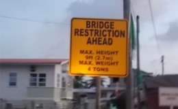 Bridge restriction sign along roadway