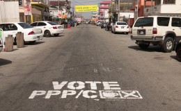 On Robb St,  a sign has been painted on the road in favour of the PPP/C while farther down the road a banner has been strung in support of APNU+AFC.