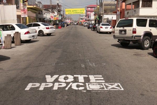 On Robb St,  a sign has been painted on the road in favour of the PPP/C while farther down the road a banner has been strung in support of APNU+AFC.