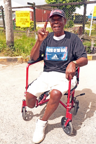 This differently-able man was able to vote at the Diamond Secondary School this afternoon after he was carried up two flights of stairs. (Arian Browne photo)
