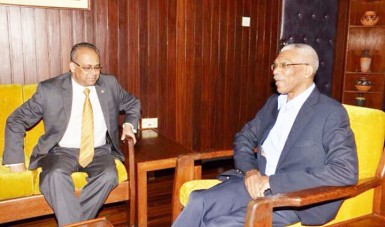 Head of State, David Granger (right) and Deputy Secretary General of the Organisation of American States, Ambassador Albert Ramdin during their meeting at the Ministry of the Presidency yesterday. As part of his farewell visits to countries, Ramdin paid a courtesy call on Granger. (GINA photo) 