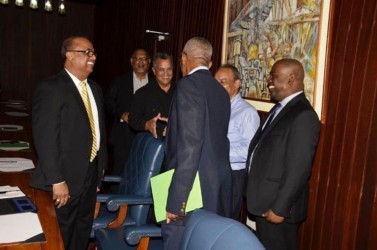 President David Granger (back to camera) shaking hands with Gerry Gouveia. At left is Manniram Prashad. At right is Private Sector Commission Chairman, Ramesh Persaud. Partially hidden (second from right) is businessman Eddie Boyer. Also in photograph is Ramesh Dookhoo. (GINA photo) 