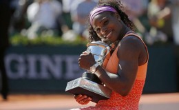 Serena Williams of the U.S. poses with the trophy during the ceremony after defeating Lucie Safarova of the Czech Republic during their women’s singles final match to win the French Open tennis tournament at the Roland Garros stadium in Paris, France, yesterday. REUTERS/Vincent Kessler
