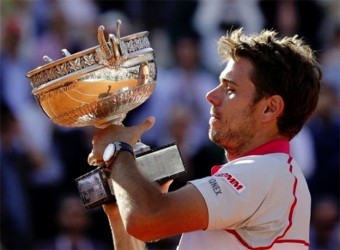 Stan Wawrinka of Switzerland poses with the trophy during the ceremony after winning the men’s final match against Novak Djokovic of Serbia at the French Open tennis tournament at the Roland Garros stadium in Paris, France,  yesterday.REUTERS/VINCENT KESSLER