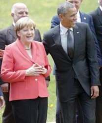 German Chancellor Angela Merkel poses with US President Barack Obama before taking a ‘family’ picture at the G7 summit at the Elmau castle in Kruen near Garmisch-Partenkirchen, Germany, June 8, 2015. (Reuters/Christian Hartmann)