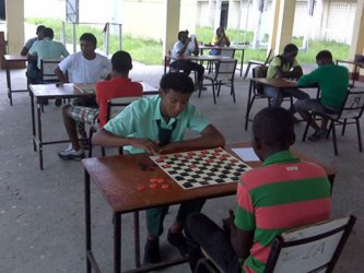 Action in the Guyana Draughts Association Inter-School draughts tournament which was contested Saturday at the North Ruimveldt Multilateral School. (photo courtesy of the GDA)
