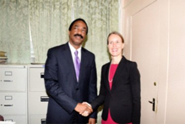  Attorney-General Basil Williams greeting Canadian High Commissioner Dr. Nicole Giles (Government Information Agency photo)