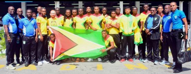 The Golden Jaguars football team prior to their departure for St Vincent and the Grenadines at the Ogle Airport on Monday