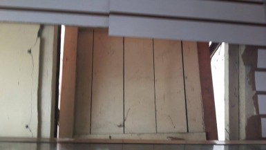 The window which the bandits broke  to make entry into the store