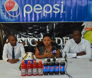 Acting General Secretary of the GFF Normalization Committee Deidre Davis (centre) addressing the gathering while Pepsi Brand Manager Larry Wills (left) and GFF Director of Marketing and Communications Rawle Toney look on.