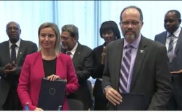 EU High Representative Federica Mogherini and CARIFORUM Secretary General Irwin LaRocque with the agreements after Thursday’s signing.  (EU Delegation photo)